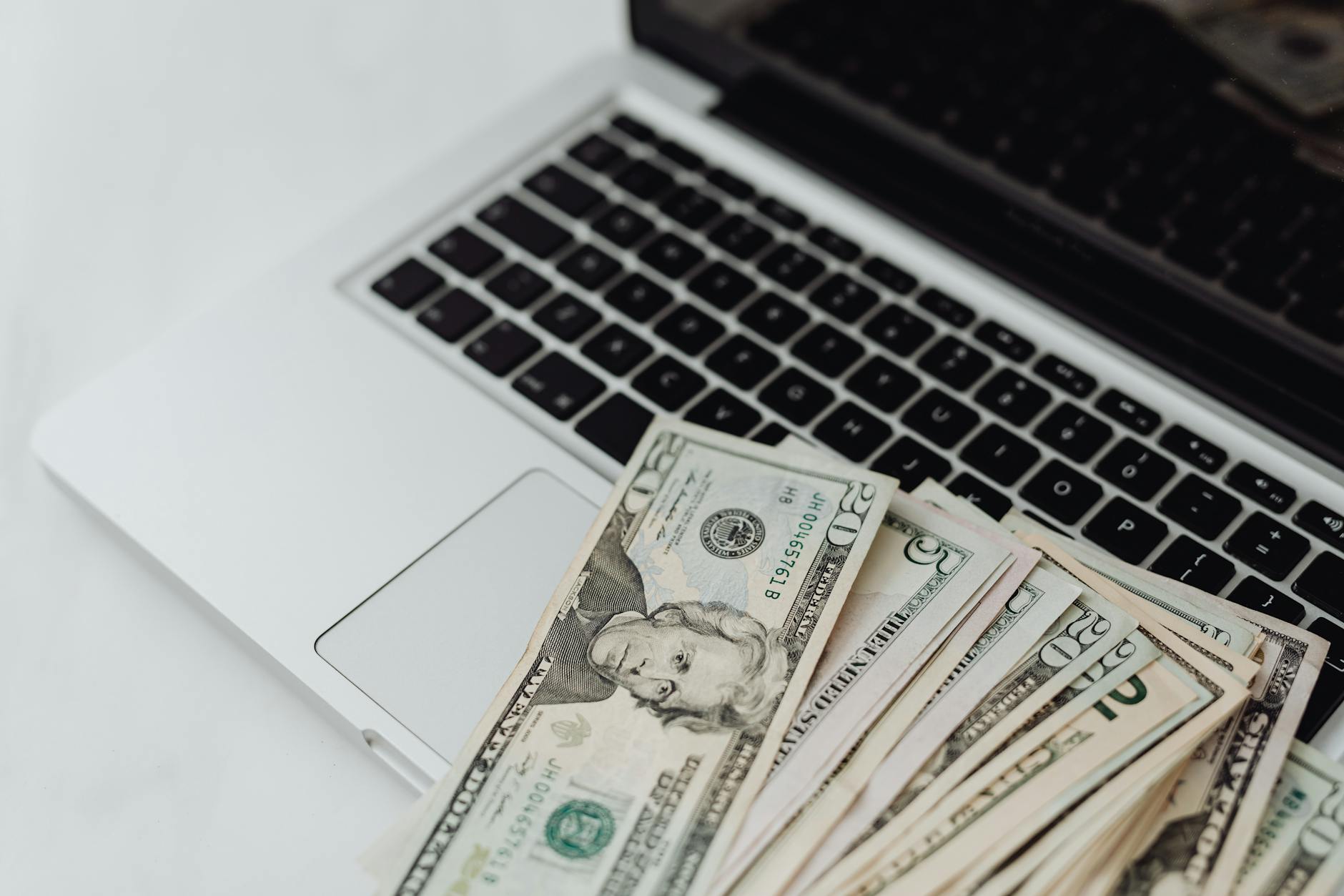 close up of money on a laptop
