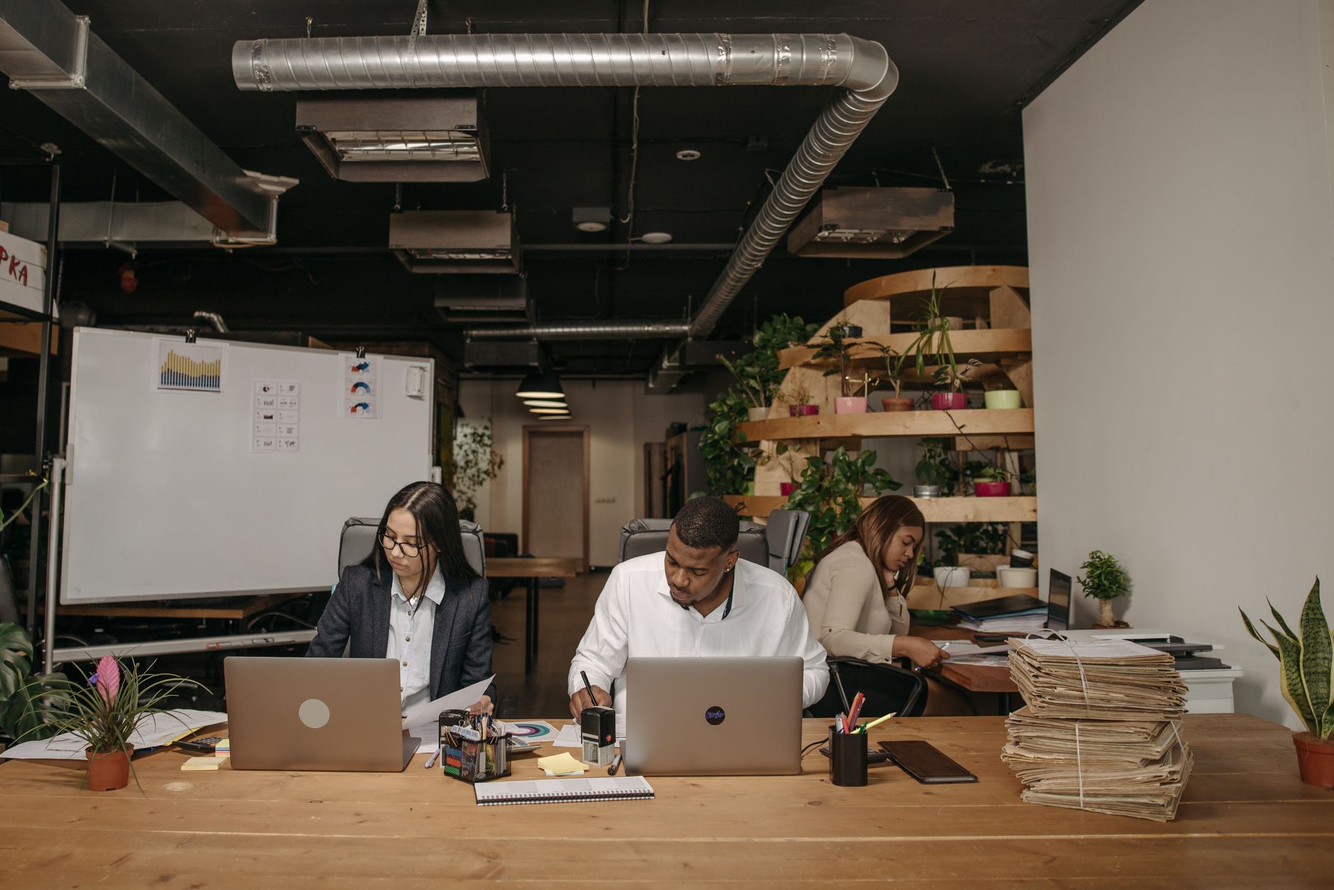 three people working in the office